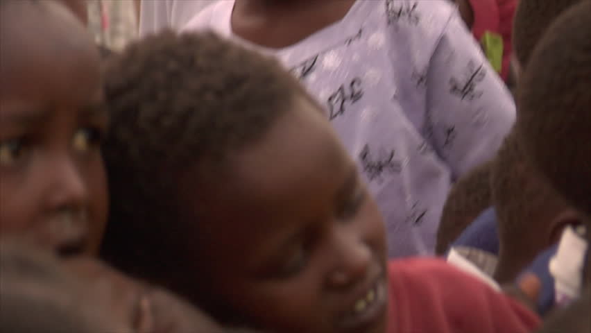 Kenya - Circa 2006: Close up view of a group of unidentified boys' faces as they