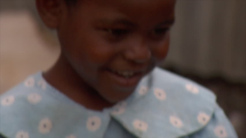 KENYA - CIRCA 2006: Close up of an unidentified little girl in a blue shirt