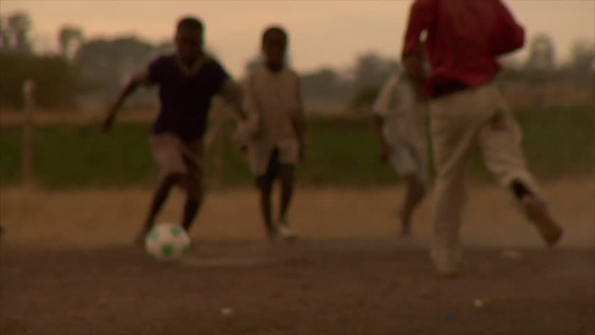KENYA - CIRCA 2006: Unidentified little Kenyan children play soccer circa 2006