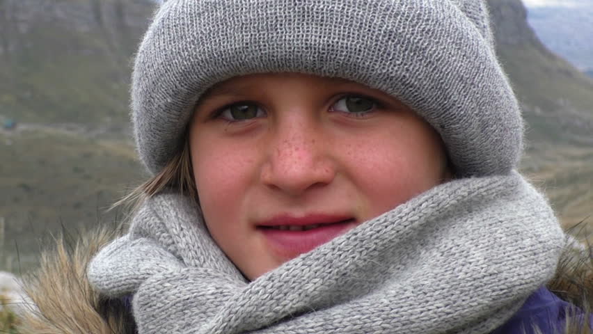 Portrait of a girl wearing a hat and scarf in autumn. Close up Handheld Shot, Slow motion, contains child 8-9 years. Montenegro, Durmitor mountains.