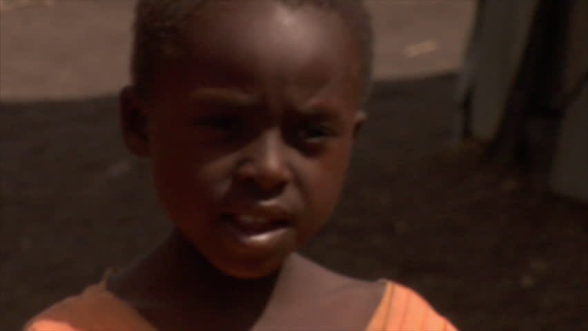 KENYA - CIRCA 2006: Unidentified little boy talks towards the camera circa 2006