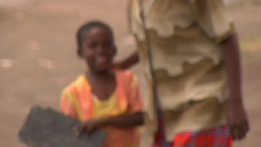 KENYA - CIRCA 2006: Unidentified African woman walks with child circa 2006 in