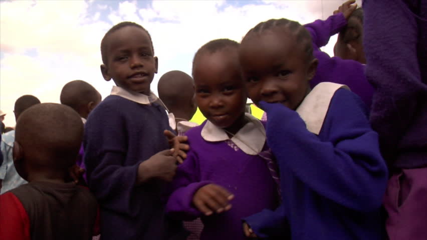 KENYA - CIRCA 2006: Unidentified kids look at the camera turn around circa 2006