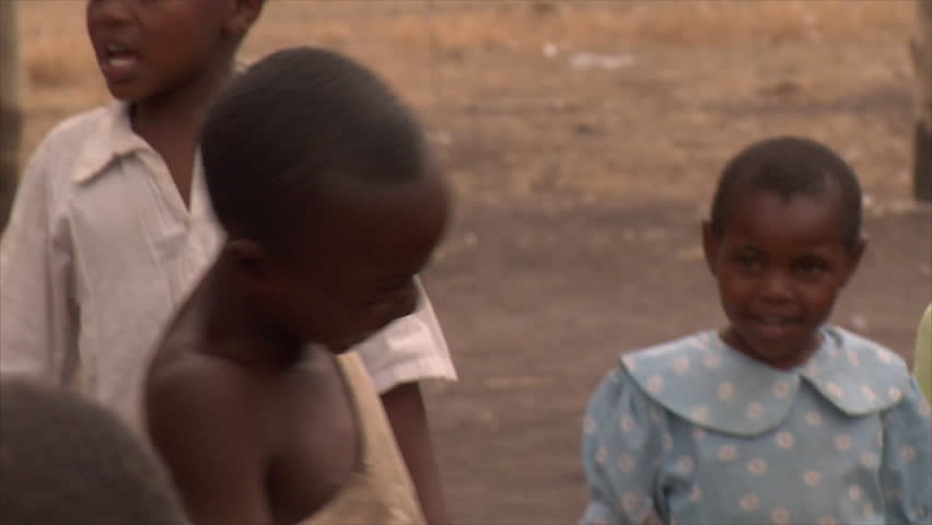 KENYA - CIRCA 2006: Unidentified boy laughs and plays circa 2006 in Kenya.