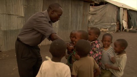 KENYA - CIRCA 2006: Unidentified kids play doctor circa 2006 in Kenya.