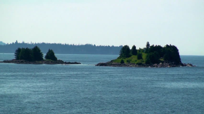 Lighthouse on tiny, green island