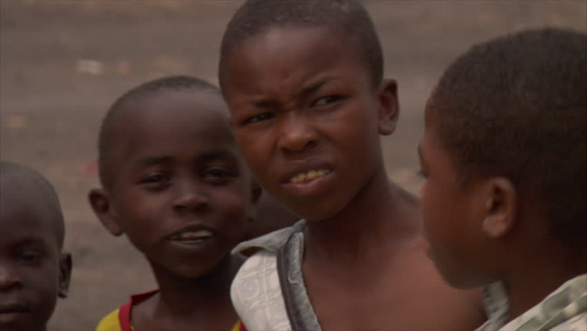 KENYA - CIRCA 2006: Unidentified young boys point and laugh at the camera circa