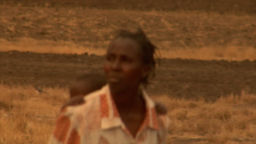 KENYA - CIRCA 2006: Unidentified mother with a baby on her back circa 2006 in