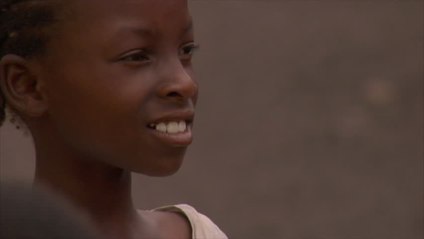KENYA - CIRCA 2006: Close up as unidentified girl looks off into the distance
