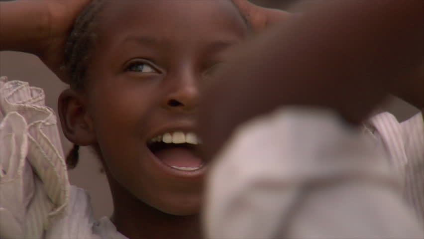 KENYA - CIRCA 2006: Unidentified little girl in a white dress circa 2006 in