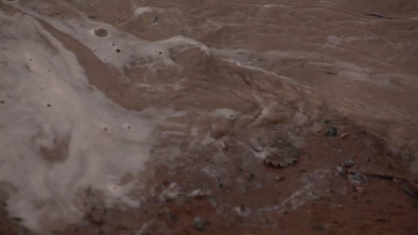 Muddy water on bank of Colorado River