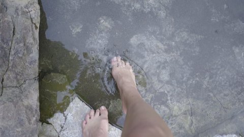 Young Woman Walks In Shallow Crystal Clear Fresh Water Stream, POV Shot OF Her Legs/Feet (Slow Motion)