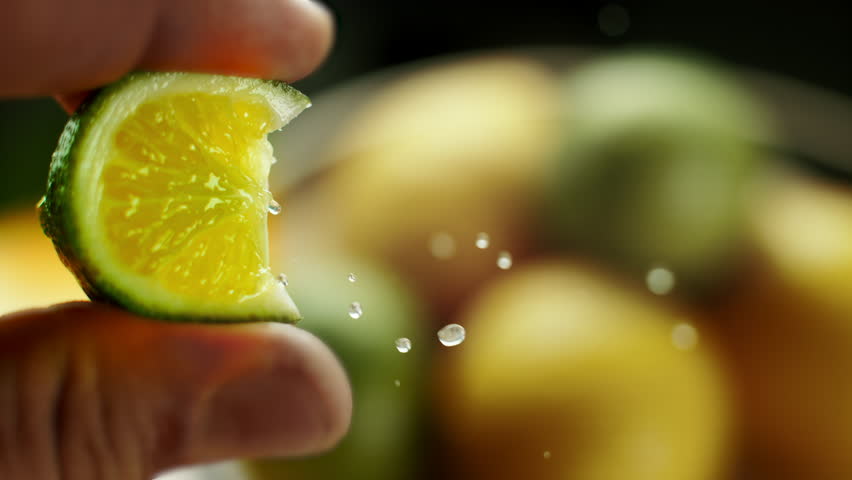 A lime squeezed in slow motion.