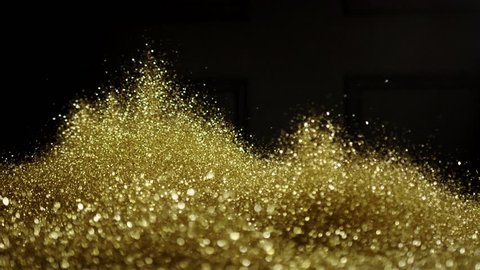 Golden glitter exploding , Red Epic slow motion clip