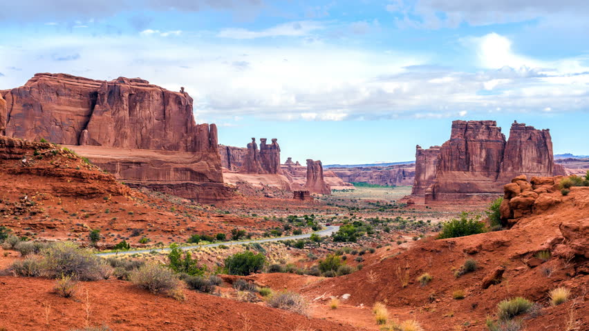Arches National Park - Time-Lapse of a cloudy summer day view of busy main road in Arches National Park, Moab, Utah, USA. 