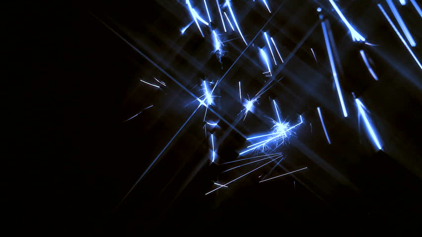 Electric blue sparks with star flares raining down