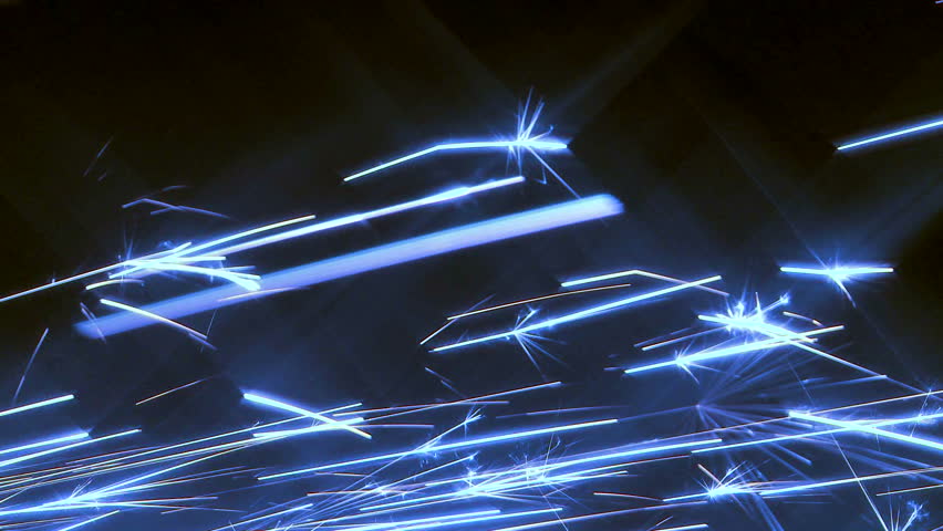 Electric blue sparks with star flares shooting across frame
