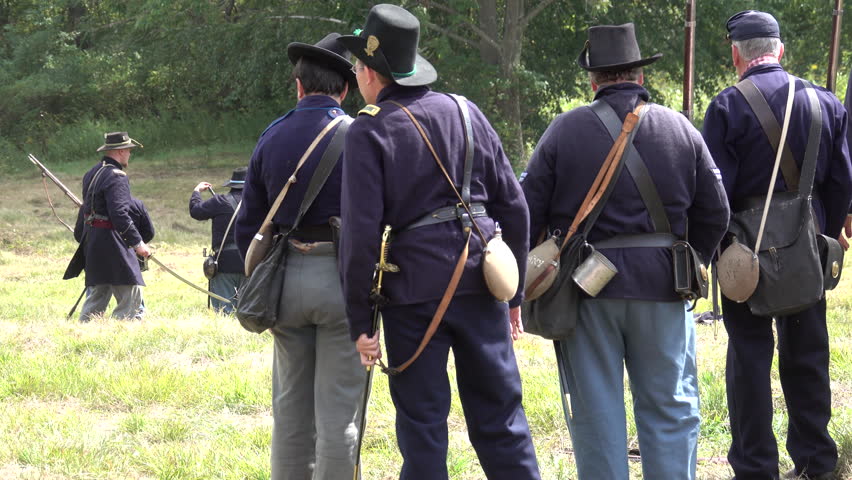View of Civil War soldiers carrying injured