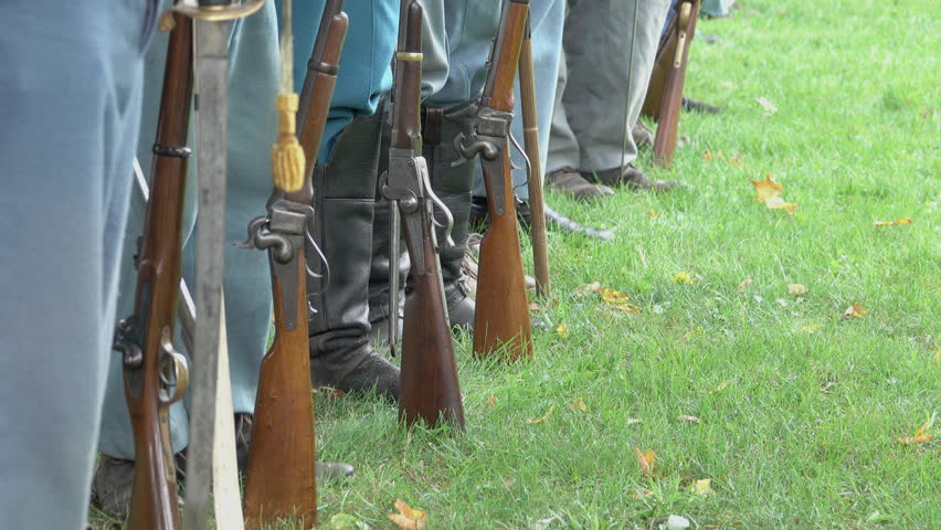 Scene of Civil War soldiers feet and guns in a row