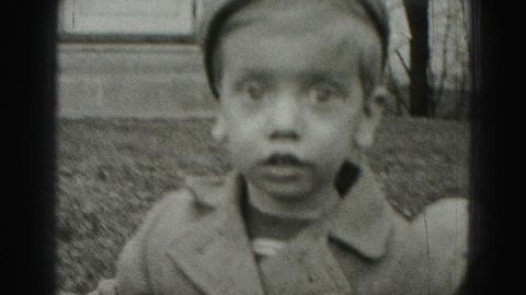 HARRISBURG 1946: big eyed poor boy with paperboy style fashion hobo dress