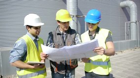 Young people in professional training on industrial site