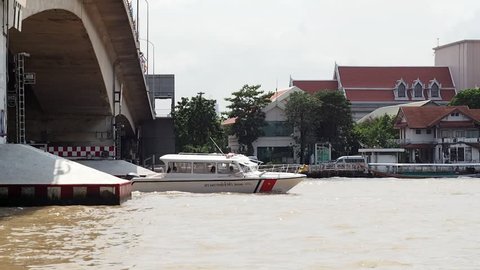 Water way CHAO PHRAYA river boat ship goods & person Transportation, BANGKOK, THAILAND. Authentic tourist attraction business life scene, vintage retro riverside walkway, taken on October 10, 2016