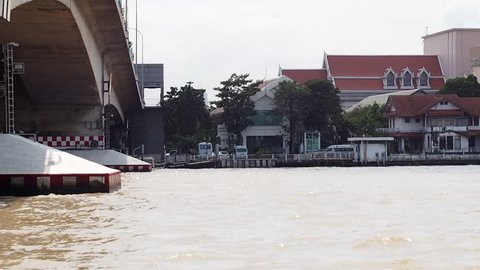 Water way CHAO PHRAYA river boat ship goods & person Transportation, BANGKOK, THAILAND. Authentic tourist attraction business life scene, vintage retro riverside walkway, taken on October 10, 2016