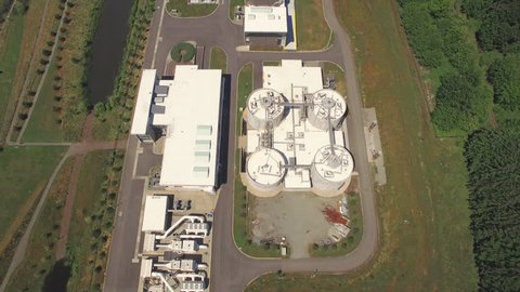 Overhead Aerial Revealing Water Sewage Treatment Plant Buildings in Rural Facility