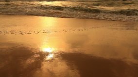 Nature background. Ocean beach waves on beach at sunset. Evening beautiful HD video