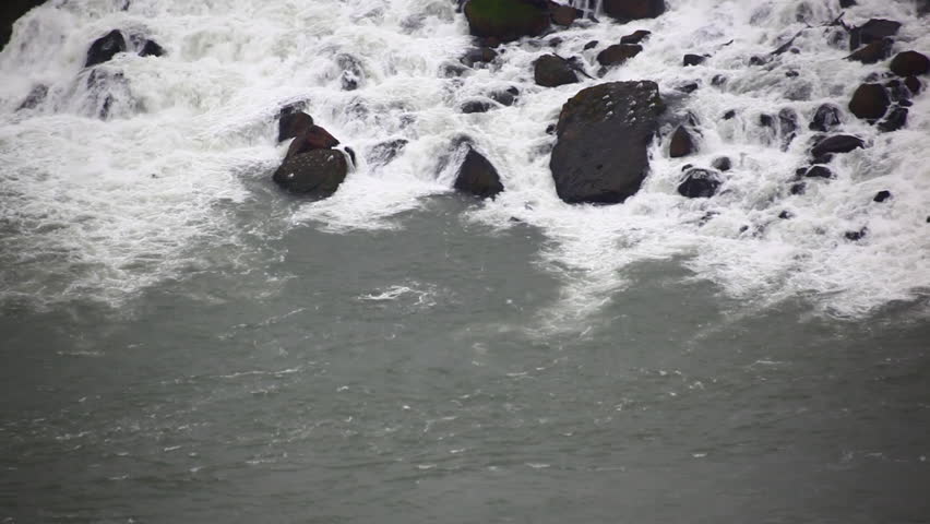 Water leaving rocks, going into river at Niagara Falls.