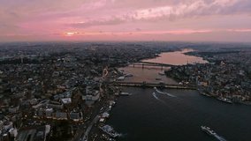 4K UHD The New Istanbul Skyline Buildings Aerial Video with Galata Tower in Eminonu, Halic, Karakoy and a Part of Goldenhorn at Sunset Dusk Time with Beautiful Sky