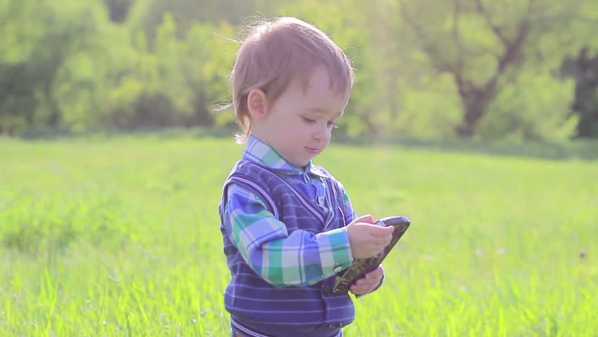 Child boy talking on the phone