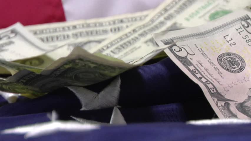 Close up of 5 Dollar Bill on the American Flag