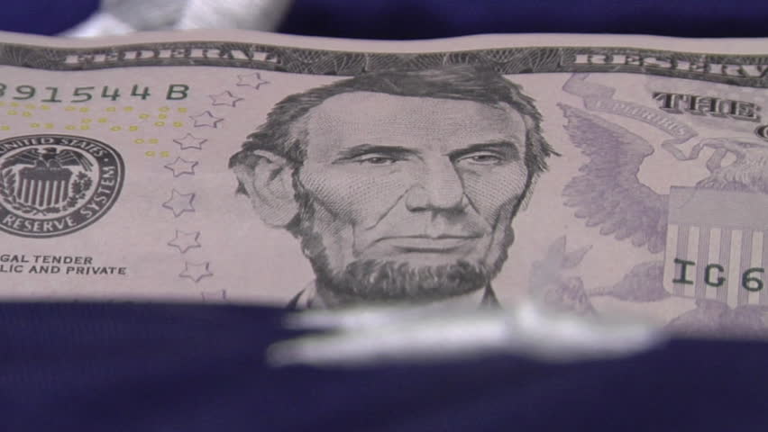 Five Dollar Bill on American Flag