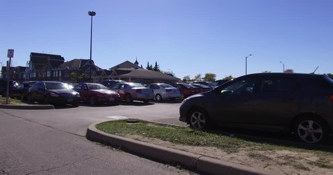 Markham, Ontario, Canada October 2016 4K Searching for a parking spot in busy shopping mall parking lot