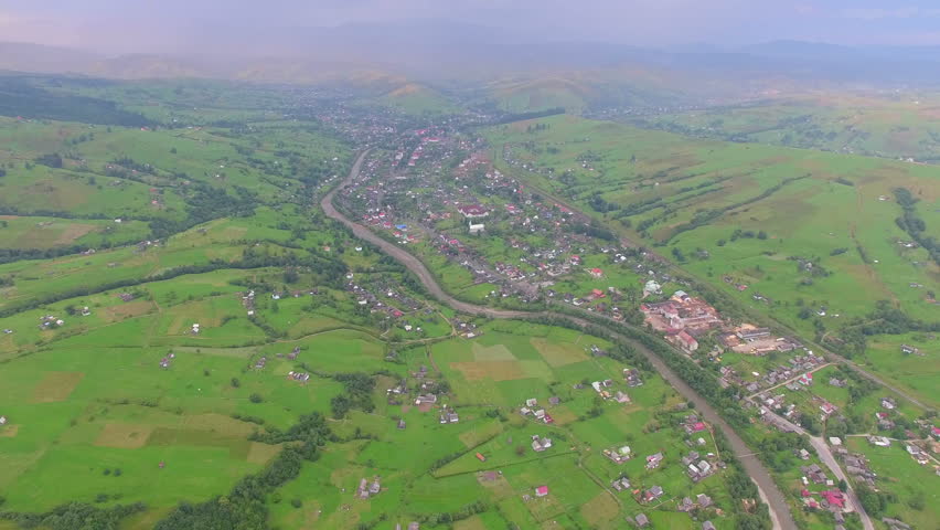 Aerial panoramic view. village in river valley