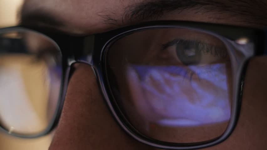 Man watching erotic content on internet reflection on glasses | Shutterstock HD Video #20334976