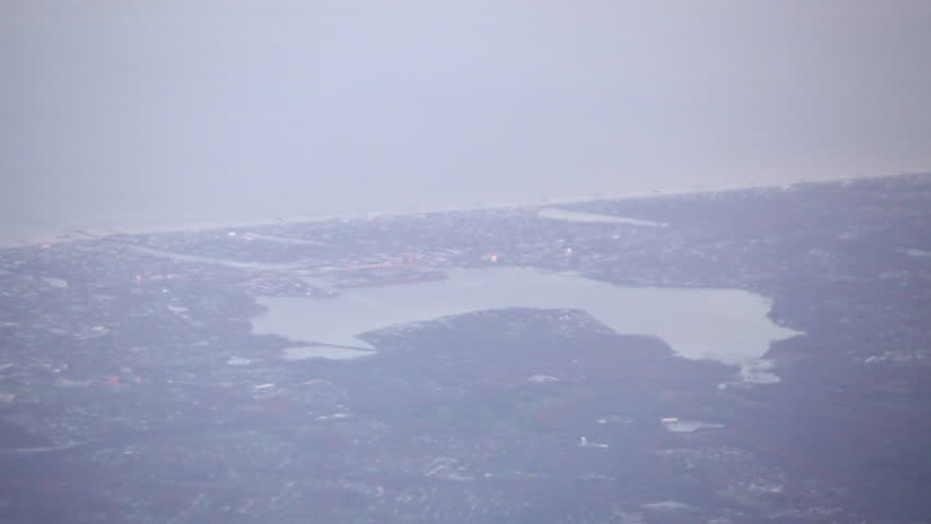 Aerial view of water and land, with lakes