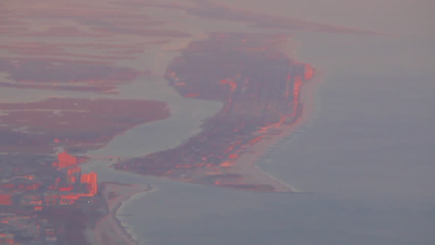 Aerial view of a peninsula in Boston at sunset.