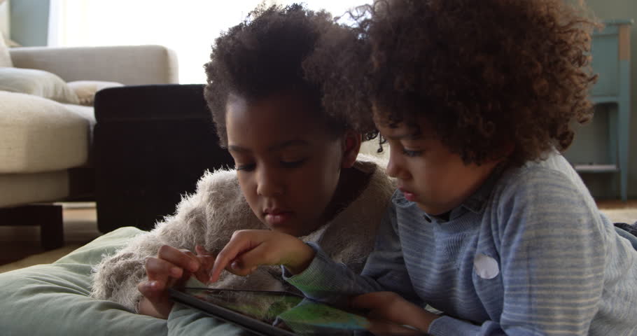 Two Children Playing With Digital Tablet At Home Shot On R3D