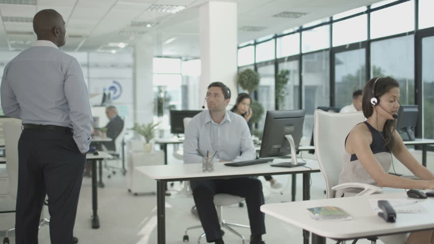 4K Manager watching over employees in financial services call center. Shot on RED Epic. | Shutterstock HD Video #20343586