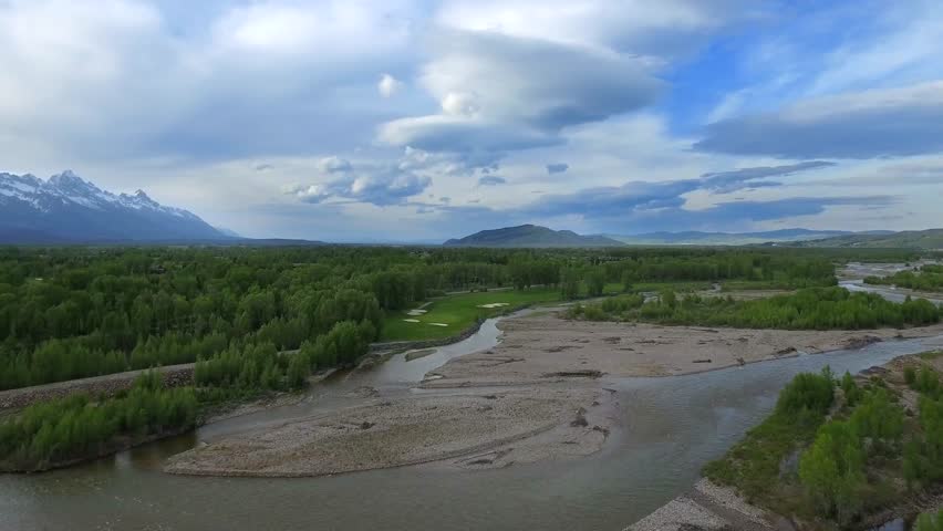 Aerial view of Wyoming river next to golf green 