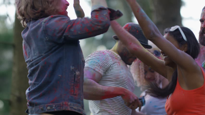 4K Happy hipster friends at music festival, dancing & throwing coloured powder. Shot on RED Epic. Royalty-Free Stock Footage #20354917