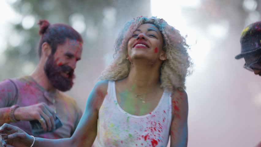 4K Happy hipster friends at music festival, dancing & throwing coloured powder. Shot on RED Epic. Royalty-Free Stock Footage #20354980
