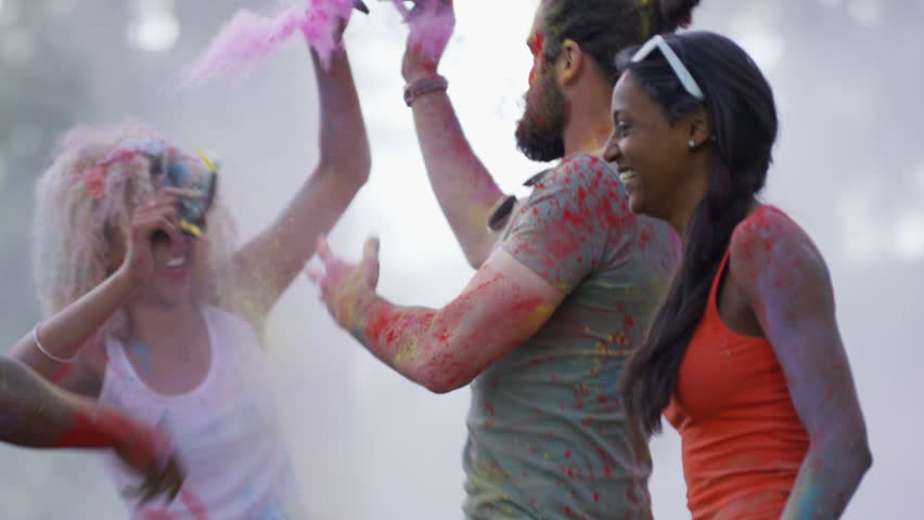 4K Happy hipster friends at music festival, dancing & throwing coloured powder. Shot on RED Epic. Royalty-Free Stock Footage #20355019