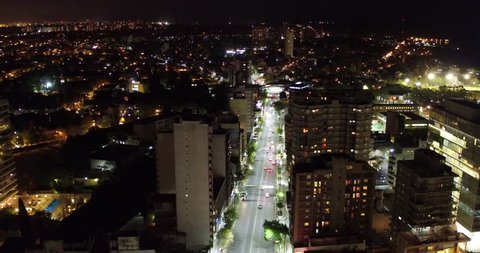 city avenue aerial night scene, the camera moves forward and then pans down