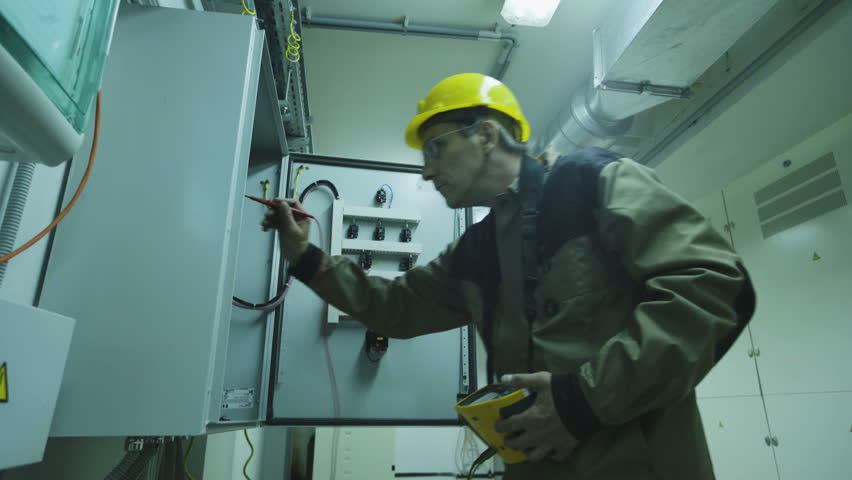 Man doing electrical metering equipment | Shutterstock HD Video #20359249
