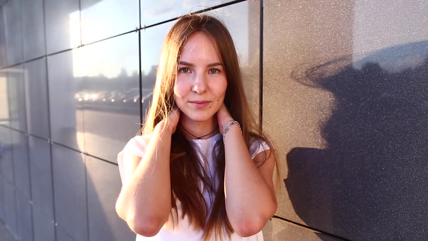 Woman Girl Lady Portrait Looking Camera Walking. Young Beautiful Student Business Female With Long Hair on the Background Building.