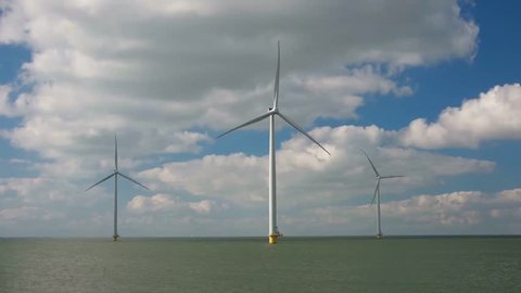 Three isolated offshore windmills at windmill farm ,Westermeerwind Wind Farm is a wind farm for and by the polder, and will provide 160,000 households,Urk Flevoland Netherlands August 2016