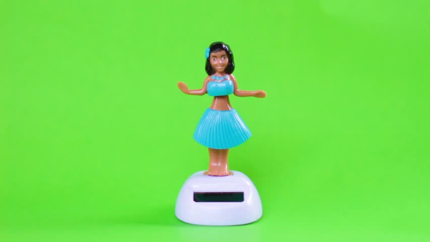 Hawaiian doll on green background.